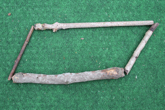 parallelogram made with two long sticks and two short sticks